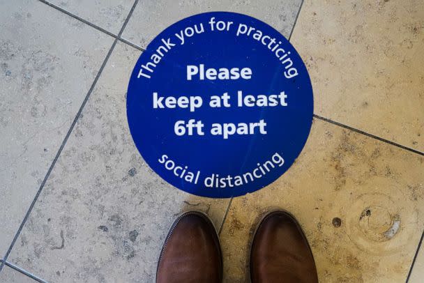 PHOTO: Social distancing signage marks the floor in Orange, Calif., April 14, 2022. (Orange County Register via Getty Images/FILE)