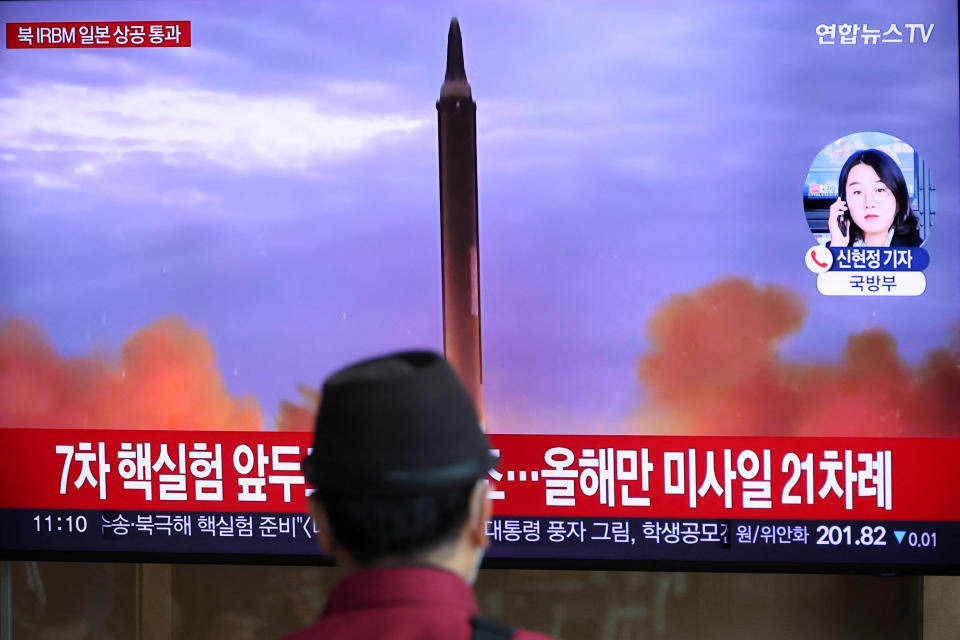 A man watches a TV broadcasting a news report on North Korea firing a ballistic missile over Japan, at a railway station in Seoul, South Korea, October 4, 2022. REUTERS/Kim Hong-Ji