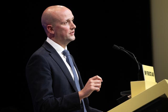 Side view of Stephen Flynn speaker from an SNP lectern