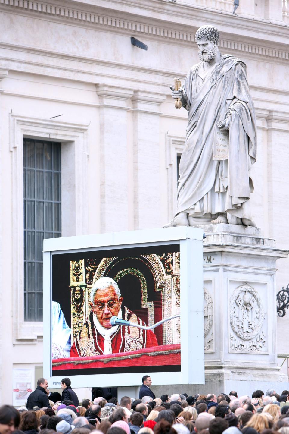 VATICAN CITY, VATICAN - DECEMBER 25: Pope Benedict XVI is projected on a screen to the crowd as he delivers his Christmas Day message from the central balcony of St Peter's Basilica on December 25, 2012 in Vatican City, Vatican. The 'Urbi et Orbi' (to the city and to the world) is recognised as a Christmas tradition by Catholics with the Pope focusing this year on the conflict in Syria, calling for a political solution. (Photo by Franco Origlia/Getty Images)