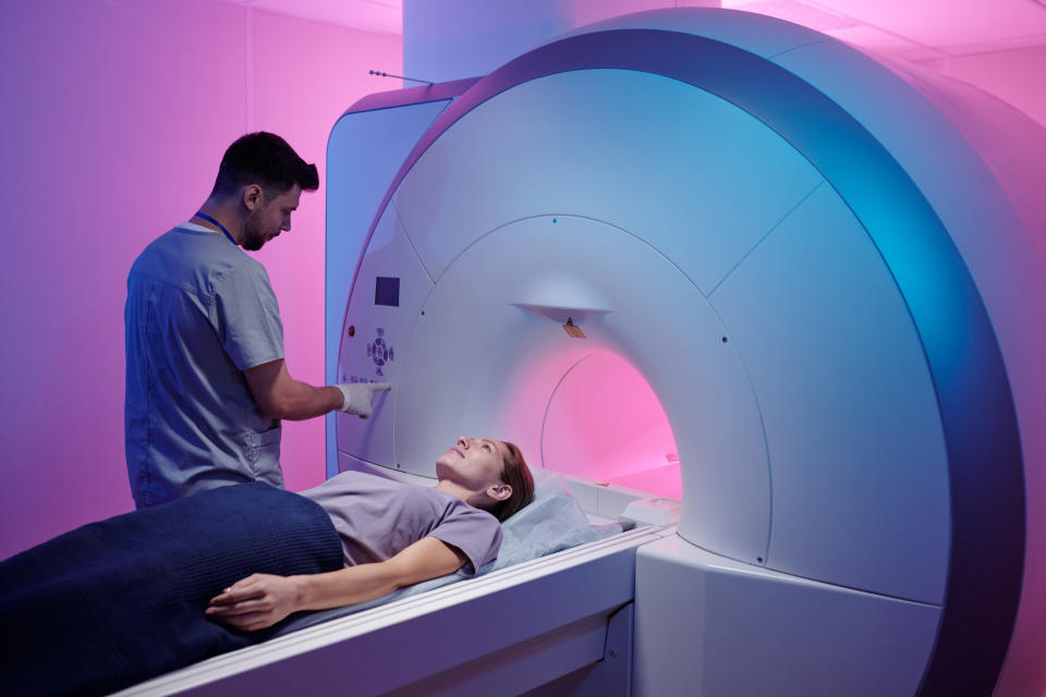 A woman in an MRI machine