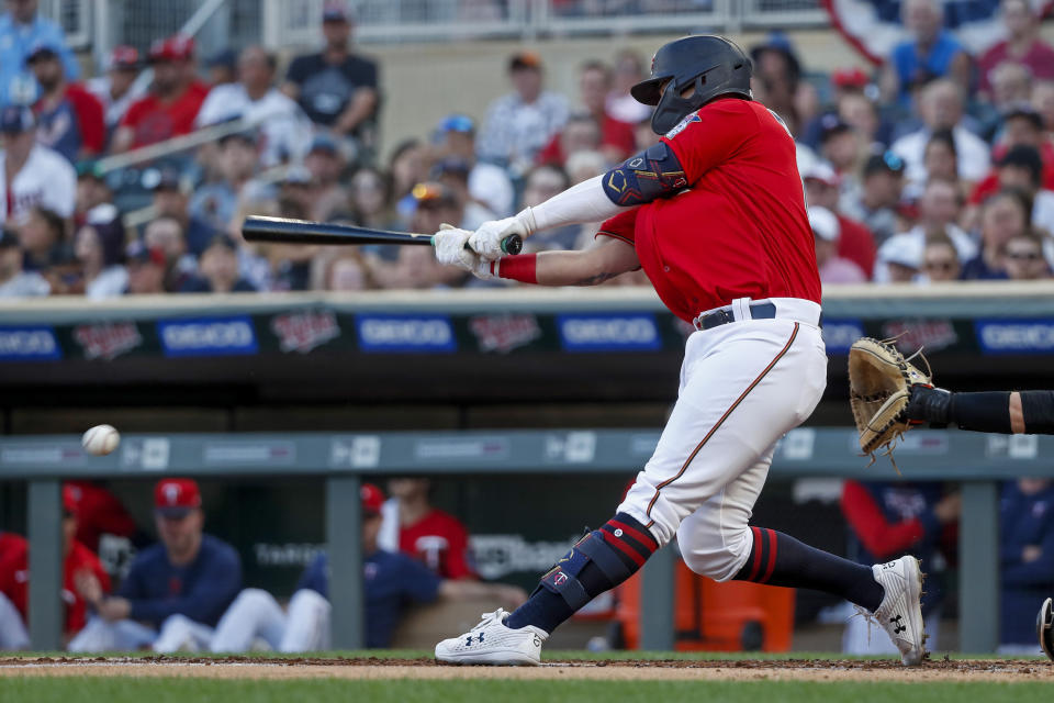 Minnesota Twins' Jose Miranda hits an RBI single against the Baltimore Orioles during the first inning of a baseball game Friday, July 1, 2022, in Minneapolis. (AP Photo/Bruce Kluckhohn)