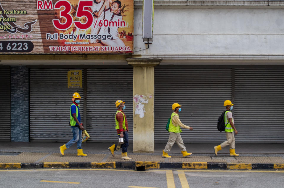 Foreign construction workers are pictured in Kuala Lumpur January 20, 2021. — Picture by Shafwan Zaidon