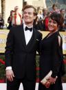 Actor Alfie Evan Allen from the television drama "Game of Thrones" and his guest arrive at the 20th annual Screen Actors Guild Awards in Los Angeles, California January 18, 2014. REUTERS/Lucy Nicholson (UNITED STATES Tags: ENTERTAINMENT)(SAGAWARDS-ARRIVALS)