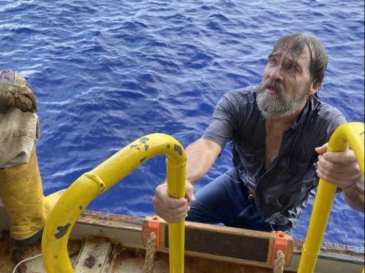 Stuart Bee climbing onboard the container ship, the Angeles, on Sunday 29 November ((US Coast Guard Southeast))