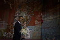 Denys Voznyi and Anna Karpenko pose for a photo before getting married in Kyiv, Ukraine, Wednesday, June 15, 2022. A growing number of couples in Ukraine are speedily turning love into matrimony because of the war with Russia. Some are soldiers, marrying just before they head off to fight. Others are united in determination that living and loving to the full are more important than ever in the face of death and destruction. (AP Photo/Natacha Pisarenko)