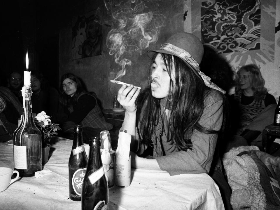 A man smokes cannabis inside Christiania in 1976.