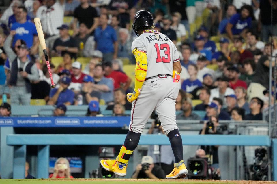 Atlanta Braves' Ronald Acuna Jr. tosses his bat after hitting a grand slam during the second inning of a baseball game against the Los Angeles Dodgers Thursday, Aug. 31, 2023, in Los Angeles. (AP Photo/Mark J. Terrill)