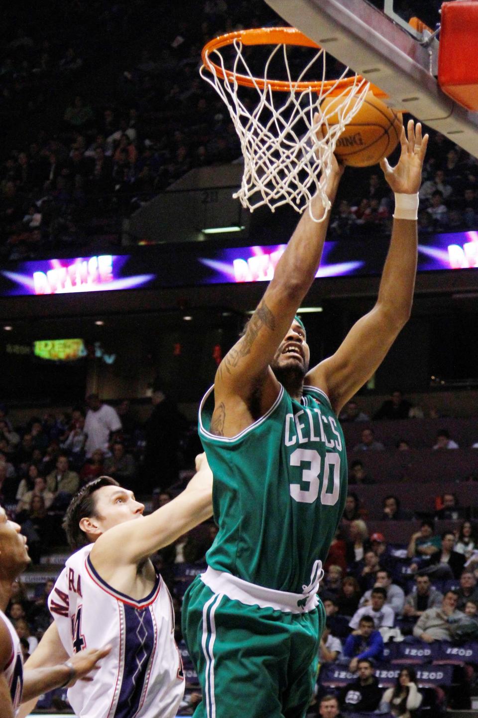 Nov 7, 2009; East Rutherford, NJ, USA; Boston Celtics forward-center Rasheed Wallace (30) drives to the basket against <a class="link " href="https://sports.yahoo.com/nba/teams/brooklyn/" data-i13n="sec:content-canvas;subsec:anchor_text;elm:context_link" data-ylk="slk:New Jersey Nets;sec:content-canvas;subsec:anchor_text;elm:context_link;itc:0">New Jersey Nets</a> forward Eduardo Najera (14) during the first half at the Izod Center. Jim O’Connor-USA TODAY Sports