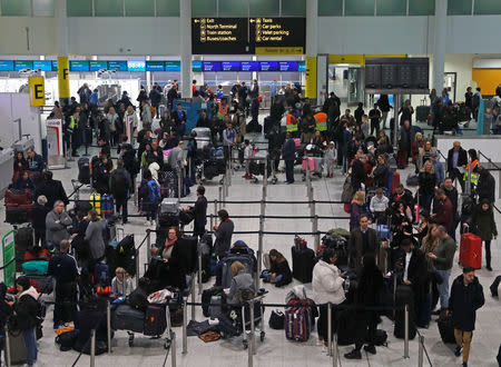 Passengers wait around in the South Terminal building at Gatwick Airport after drones flying illegally over the airfield forced the closure of the airport, in Gatwick, Britain, December 20, 2018. REUTERS/Peter Nicholls