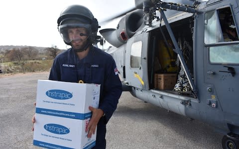 Royal Navy ground crew unloading Dfid disaster stores from a Wildcat helicopter at Tortola airport in the British Virgin Islands, as Hurricane Irma bears down on the US mainland with increased strength - Credit: PA