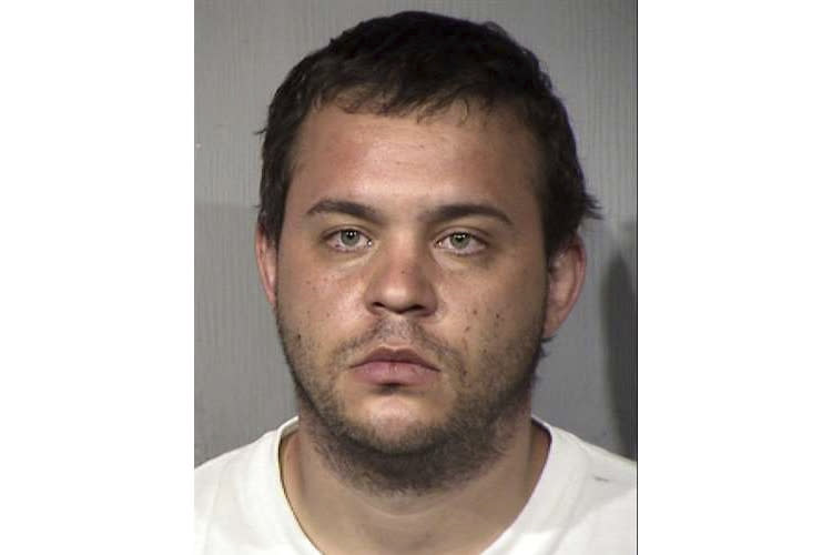 FILE - A booking photo provided by the Maricopa County Sheriff's Office in Phoenix shows Matthew Egler. Authorities on Wednesday, July 29, 2020, announced the arrest of Egler, 29, on one count of arson for a fire that destroyed much of the Arizona and Maricopa County Democratic Party headquarters. (Maricopa County Sheriff's Office via AP)