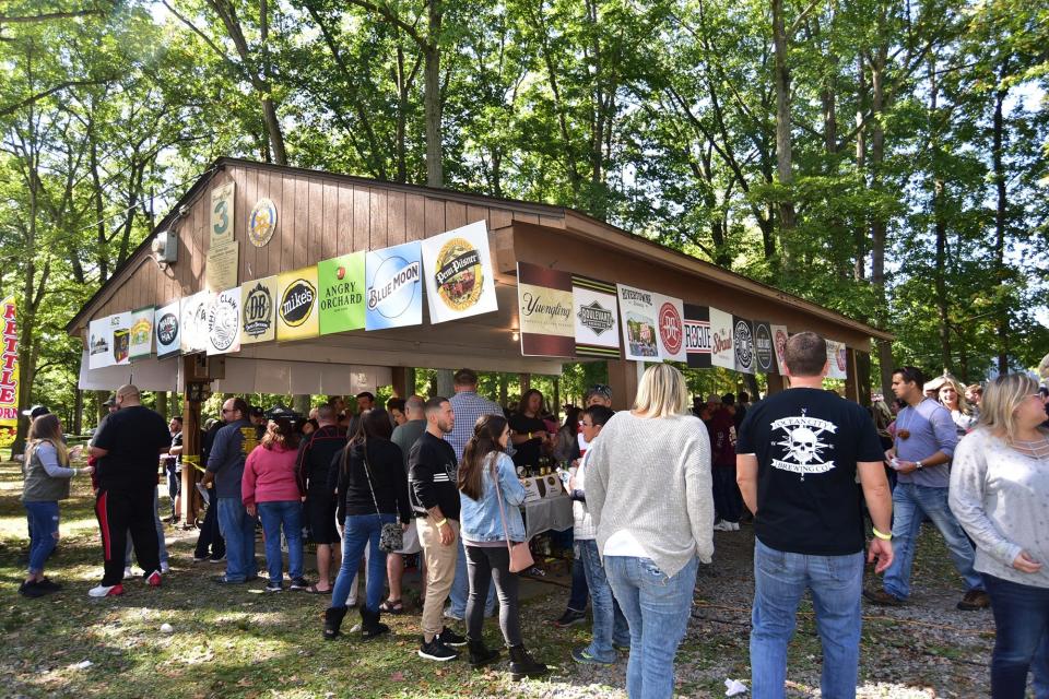 Folks line up for beer during the 10th annual Oktoberfest Beer Festival in Ellwood City's Ewing Park.