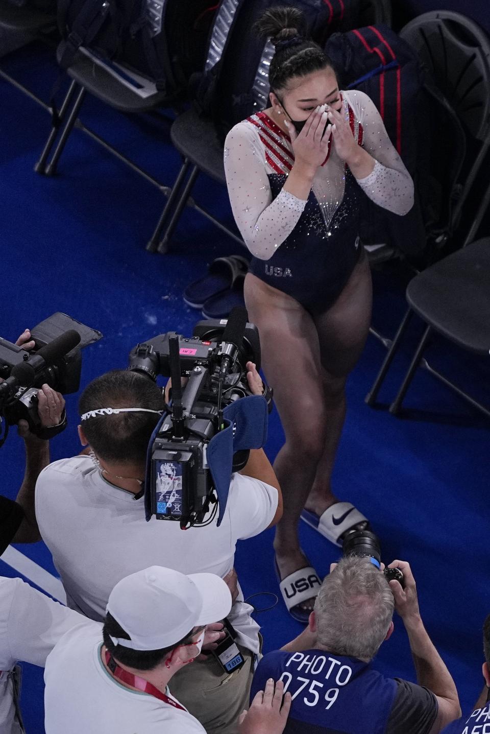 Sunisa Lee, of the United States, reacts as she learns she won the gold medal during the artistic gymnastics women's all-around final at the 2020 Summer Olympics, Thursday, July 29, 2021, in Tokyo. (AP Photo/Morry Gash)