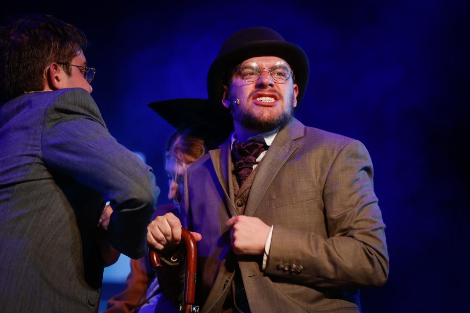Steven Horn as Doctor Watson narrates a scene during dress rehearsal of Tent Theatre's "Ken Ludwig's Baskerville: A Sherlock Holmes Mystery" on Wednesday, July 5, 2023.