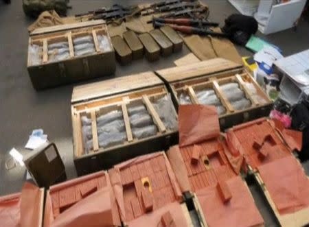 Weapons confiscated by Ukraine's state security service (SBU) from a detained French citizen who had been planning attacks in France to coincide with the Euro 2016 football championship it is hosting, on the Ukrainian-Polish border in Volyn region, Ukraine, in this still image taken from video June 6, 2016. Ukraine's State Security Service via Reuters TV