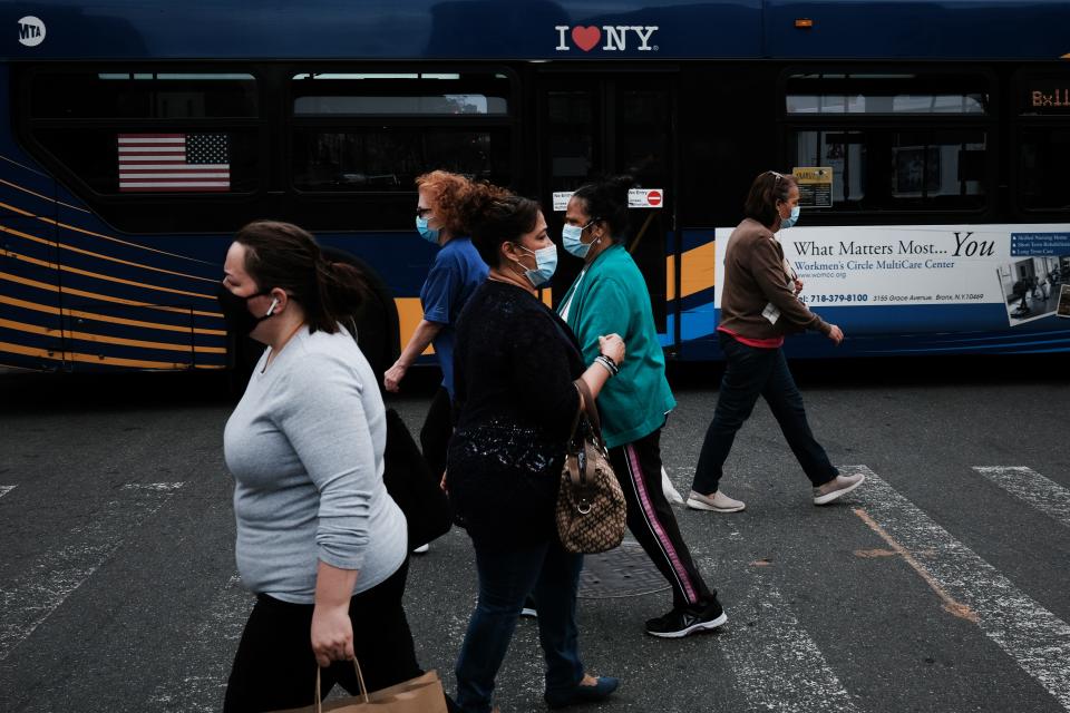 People walk through the Washington Heights neighborhood in Manhattan on June 11, 2021, in New York City. Washington Heights, a neighborhood defined by its Dominican and Latino immigrant population, is the subject of the new film “In the Heights.”