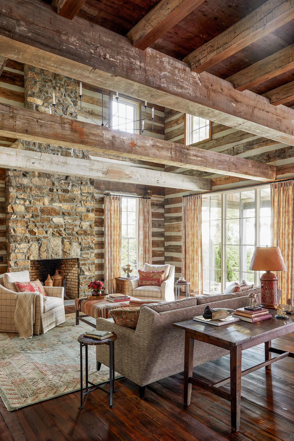 a north carolina mountain house with a stone fireplace