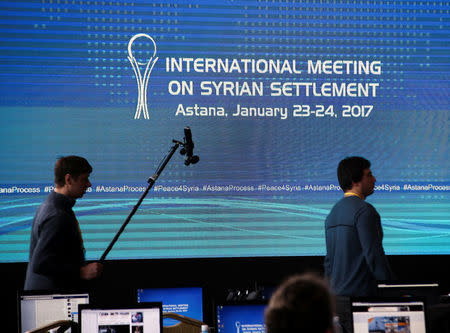 Reporters walk in the media center set for Syria peace talks, in Astana, Kazakhstan, January 23, 2017. REUTERS/Mukhtar Kholdorbekov