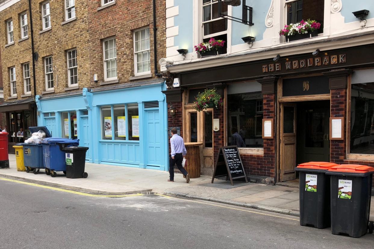 Residents in London's Bermondsey Street today claimed victory over restaurateurs and publicans in a two-year row over rubbish bins: Johnathan Beaumont