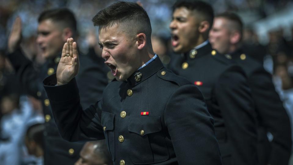 Newly commissioned U.S. Marine Corps second lieutenants take the oath of office during the U.S. Naval Academy's Class of 2023 graduation ceremony. (Chad J. McNeeley/DoD)