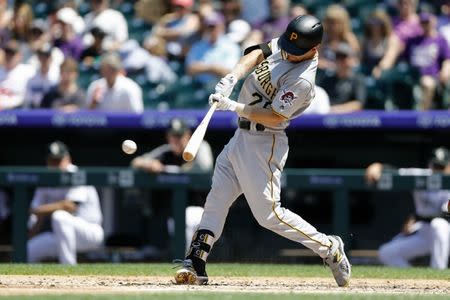 Aug 8, 2018; Denver, CO, USA; Pittsburgh Pirates second baseman Adam Frazier (26) hits a double in the third inning against the Colorado Rockies at Coors Field. Isaiah J. Downing-USA TODAY Sports