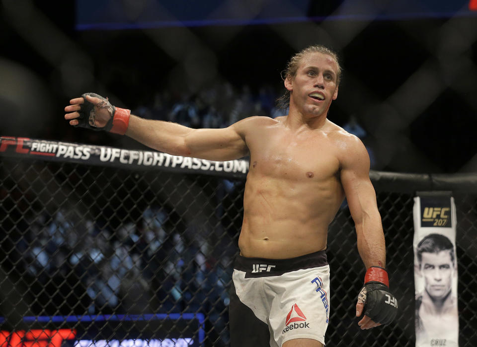 Urijah Faber reacts after beating Brad Pickett during a UFC Fight Night mixed martial arts fight in Sacramento, Calif., Saturday, Dec. 17, 2016. (AP Photo/Jeff Chiu)