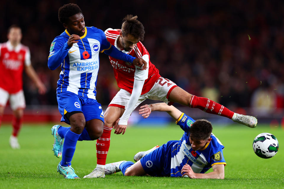 LONDON, ENGLAND - NOVEMBER 09: Fabio Vieira of Arsenal  battles for possession with Tariq Lamptey and Billy Gilmour of Brighton & Hove Albion during the Carabao Cup Third Round match between Arsenal and Brighton & Hove Albion at Emirates Stadium on November 09, 2022 in London, England. (Photo by Clive Rose/Getty Images)