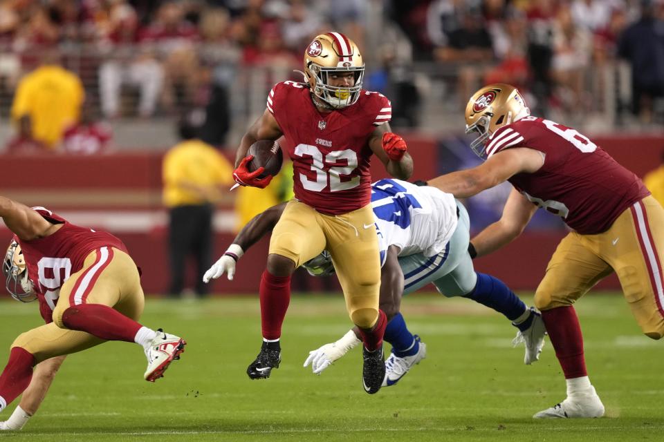Oct 8, 2023; Santa Clara, California, USA; San Francisco 49ers running back Tyrion Davis-Price (32) carries the ball against <a class="link " href="https://sports.yahoo.com/nfl/teams/dallas/" data-i13n="sec:content-canvas;subsec:anchor_text;elm:context_link" data-ylk="slk:Dallas Cowboys;sec:content-canvas;subsec:anchor_text;elm:context_link;itc:0">Dallas Cowboys</a> linebacker <a class="link " href="https://sports.yahoo.com/nfl/players/31048/" data-i13n="sec:content-canvas;subsec:anchor_text;elm:context_link" data-ylk="slk:Malik Jefferson;sec:content-canvas;subsec:anchor_text;elm:context_link;itc:0">Malik Jefferson</a> (46) as offensive tackle <a class="link " href="https://sports.yahoo.com/nfl/players/32823/" data-i13n="sec:content-canvas;subsec:anchor_text;elm:context_link" data-ylk="slk:Colton McKivitz;sec:content-canvas;subsec:anchor_text;elm:context_link;itc:0">Colton McKivitz</a> (right) blocks during the fourth quarter at Levi’s Stadium. Mandatory Credit: Darren Yamashita-USA TODAY Sports