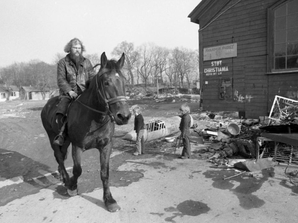 A man rides his horse through Christiania in 1976.