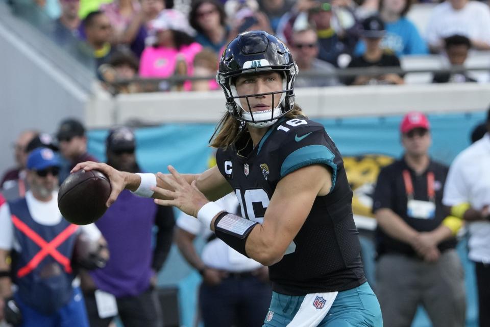 Jacksonville Jaguars quarterback Trevor Lawrence (16) sets back to pass during the first half of an NFL football game against the Baltimore Ravens, Sunday, Nov. 27, 2022, in Jacksonville, Fla. (AP Photo/John Raoux)