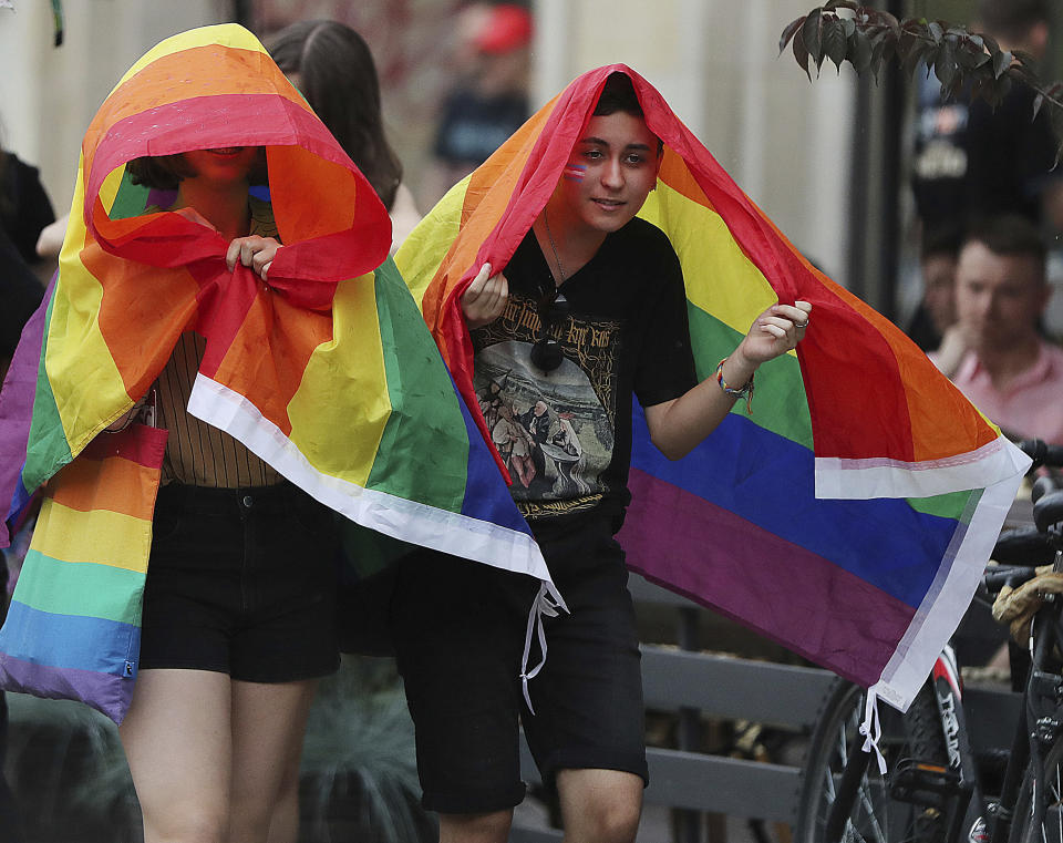 People take part in a gay pride parade in Warsaw, Poland, on Saturday, June 8, 2019. The Equality Parade is the largest gay pride parade in central and Eastern Europe. It brought thousands of people to the streets of Warsaw at a time when the LGBT rights movement in Poland is targeted by hate speeches and a government campaign depicting it as a threat to families and society. (AP Photo/Czarek Sokolowski)