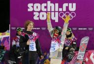 Switzerland's winner Iouri Podladtchikov (L) watches as Shaun White of the U.S. (R) gestures after the men's snowboard halfpipe final event at the 2014 Sochi Winter Olympic Games, in Rosa Khutor February 11, 2014. REUTERS/Mike Blake