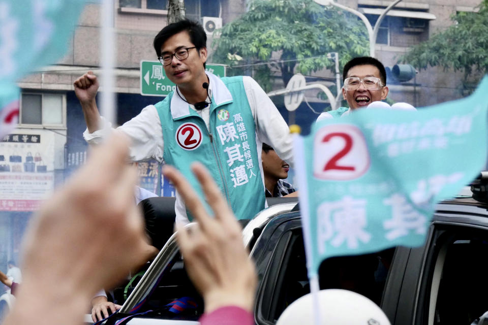 In this Nov. 20, 2018, photo, Democratic Progressive Party Kaohsiung mayoral candidate, Chen Chi-mai at left reacts to supporters during a rally in Kaohsiung, central Taiwan. China and its growing pressure campaign loom large as Taiwan holds elections for mayors and other local officials Saturday, in what is partly seen as a referendum on the policies of independence-leaning President Tsai Ing-wen. (AP Photo)