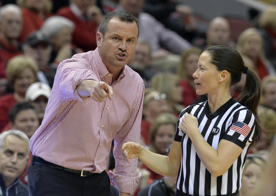 Louisville coach Jeff Walz argues a call with game official Maj Forsberg during the first half of an NCAA college basketball game against Connecticut in Louisville, Ky., Thursday, Jan. 31, 2019. (AP Photo/Timothy D. Easley)