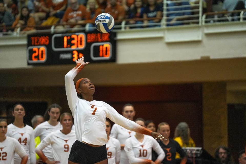 Texas Longhorns middle blocker Asjia O'Neal (7) serves the ball during the volleyball match against Baylor at the University of Texas at Austin on Thursday, Oct. 26, 2023.