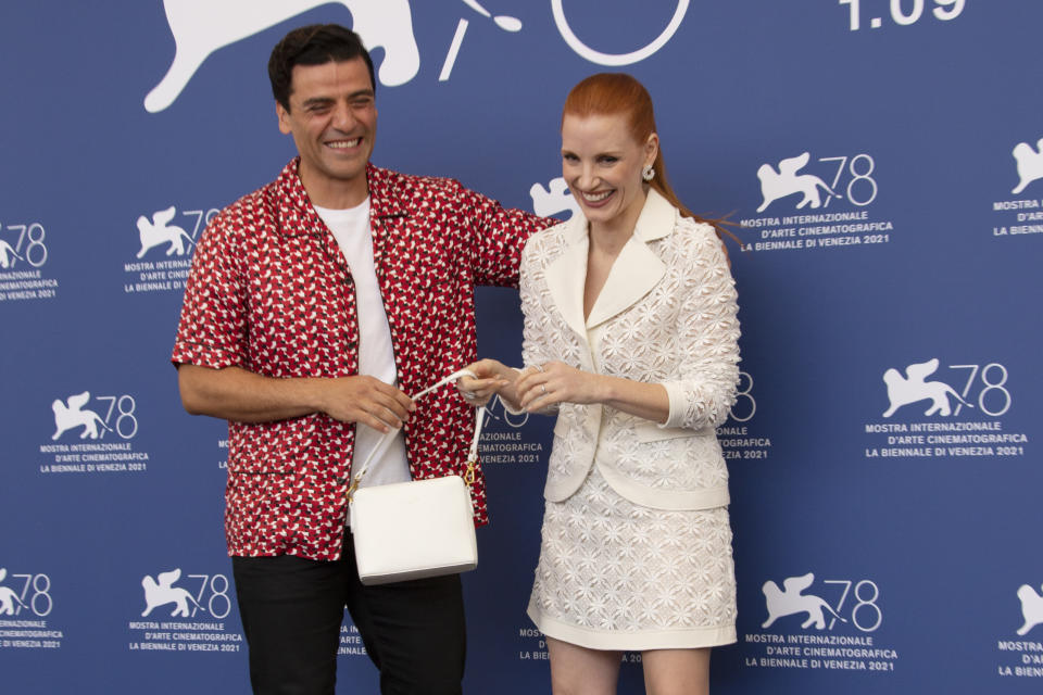 Oscar Isaac, left, and Jessica Chastain pose for photographers at the photo call for the film 'Scenes of a Marriage' during the 78th edition of the Venice Film Festival in Venice, Italy, Saturday, Sep, 4, 2021. (Photo by Joel C Ryan/Invision/AP)