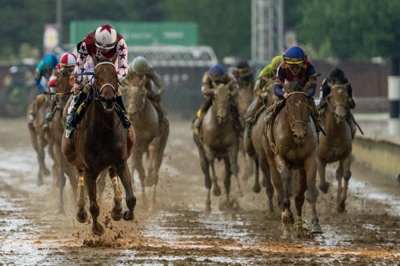 Thorpedo Anna (L), ridden by Brian Heernandez Jr., crosses the finish line to win the Kentucky Oaks at Churchill Downs in Louisville, Ky., on Friday. Photo by Pat Benic/UPI