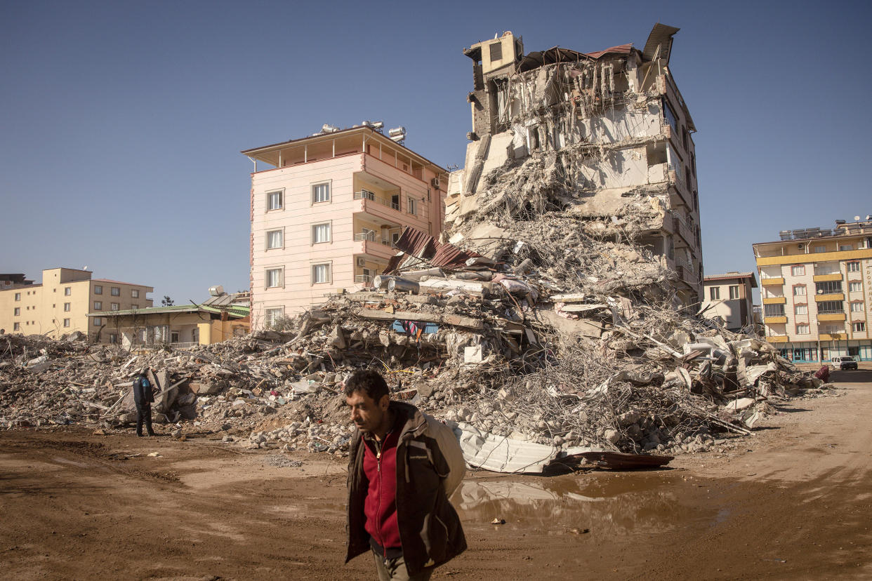 NURDAGI, TURKEY - FEBRUARY 13: A man walks past a  destroyed building on February 13, 2023 in Nurdagi, Turkey. A 7.8-magnitude earthquake hit near Gaziantep, Turkey, in the early hours of Monday, followed by another 7.5-magnitude tremor just after midday. The quakes caused widespread destruction in southern Turkey and northern Syria and has killed more than 30,000 people.   (Photo by Chris McGrath/Getty Images) *** BESTPIX *** (Chris McGrath / Getty Images file)