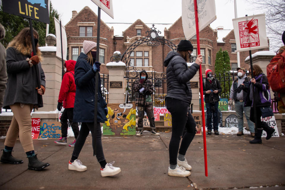 People protest against the Enbridge Energy Line 3 oil pipeline project outside the Governor's Mansion in St Paul, Minnesota.<span class="copyright">Stephen Maturen—Getty Images</span>