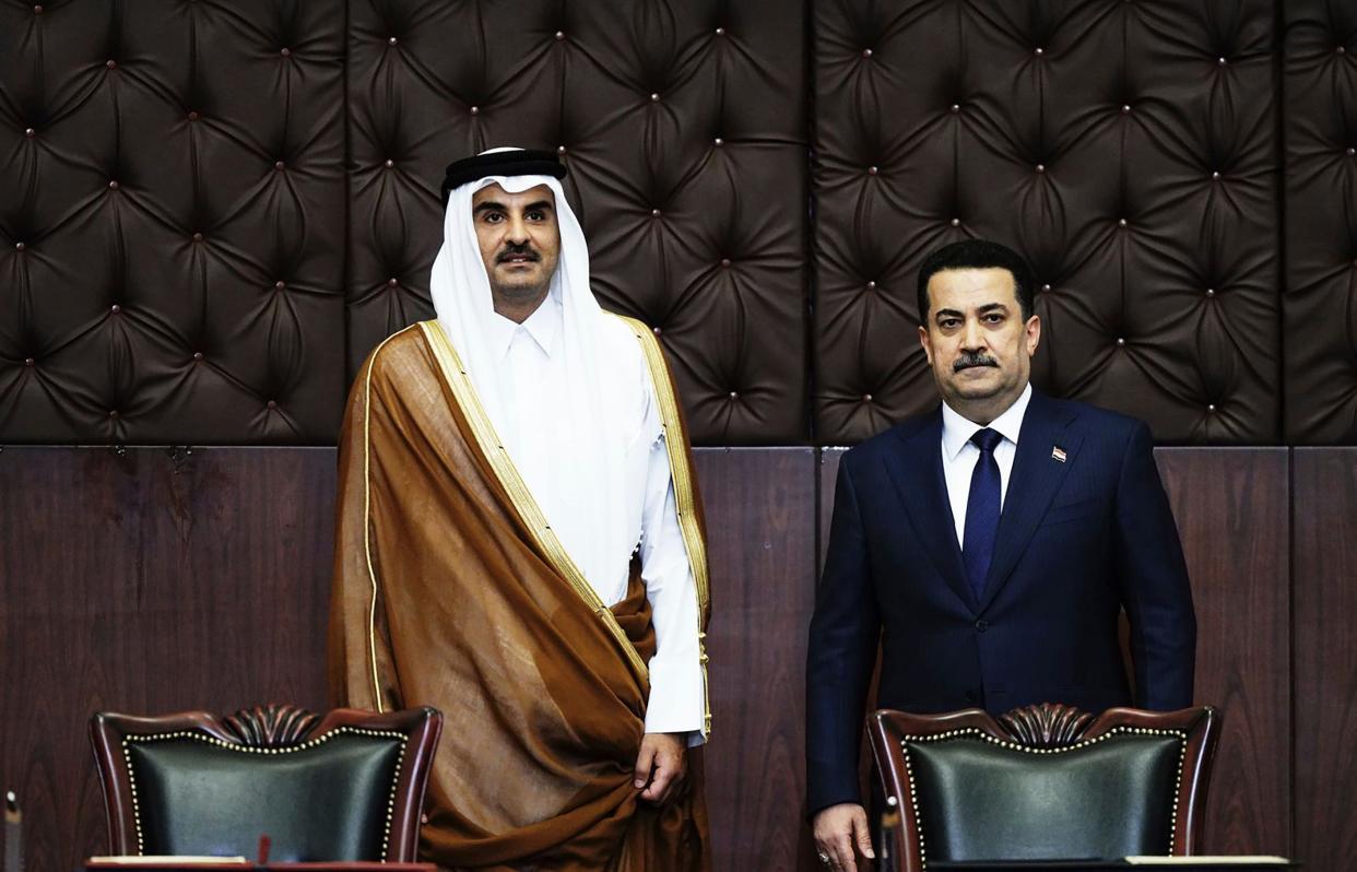 Mohammed Shia al-Sudani, right, meets with Qatar’s Emir Sheikh Tamim bin Hamad Al Thani (AP2009)