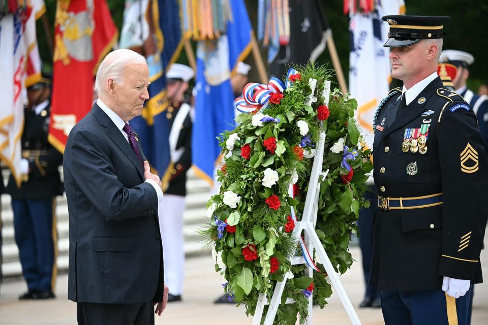 US President Joe Biden participates in a wreath laying ceremony at the Tomb of the Unknown Soldier at Arlington National Cemetery, in observance of Memorial Day on May 27, 2024, in Arlington, Virginia.