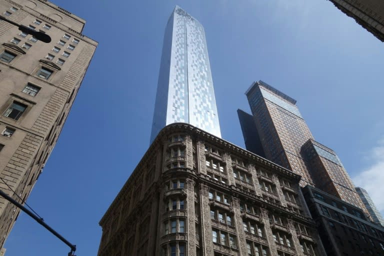 The One57 skyscraper looms above the Alwyn Court apartment building on June 16, 2015 in Midtown Manhattan in New York