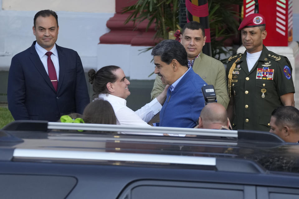 Venezuelan President Maduro, center right, receives Alex Saab, at Miraflores presidential palace in Caracas, Venezuela, Wednesday, Dec. 20, 2023. The United States freed Saab, who was arrested on a U.S. warrant for money laundering in 2020, in exchange for the release of 10 Americans imprisoned in Venezuela, U.S. officials said Wednesday. (AP Photo/Matias Delacroix)