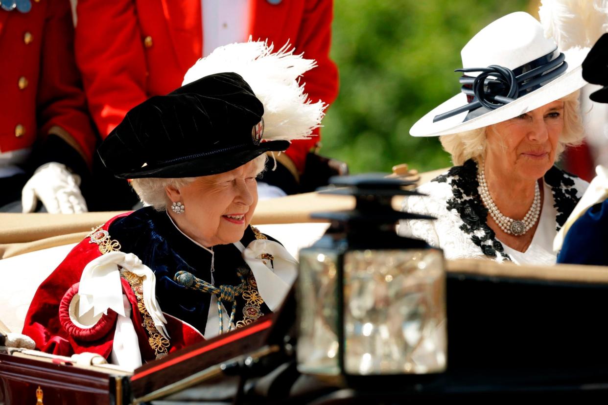 The Queen and Duchess of Cornwall leave in a carriage after attending the Most Noble Order of the Garter Ceremony: AFP/Getty Images