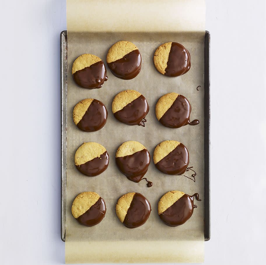 <p>The most iconic dessert duo (chocolate and peanut butter, of course) comes together for this riff on a black-and-white cookie.</p><p><em><a href="https://www.womansday.com/food-recipes/food-drinks/a29505129/chocolate-dipped-peanut-cookies-recipe/" rel="nofollow noopener" target="_blank" data-ylk="slk:Get the recipe from Woman's Day »;elm:context_link;itc:0;sec:content-canvas" class="link ">Get the recipe from Woman's Day »</a></em></p>