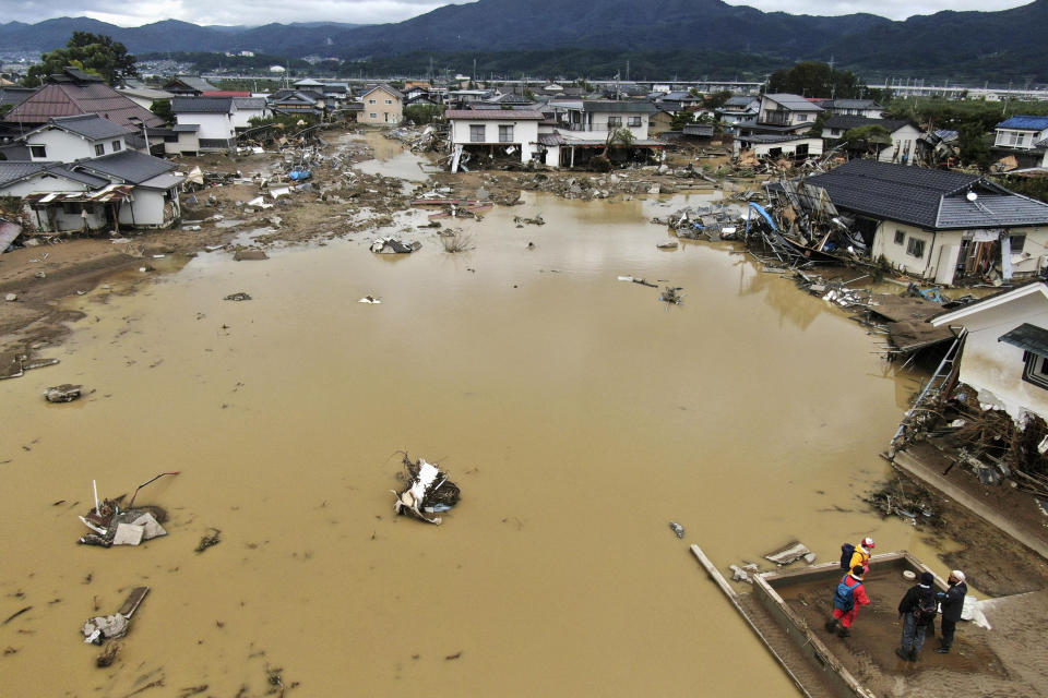 Residential area is flooded after an embankment of the Chikuma River broke due to Typhoon Hagibis, in Nagano, central Japan Tuesday, Oct. 15, 2019. Hagibis hit Japan's main island on Saturday, unleashing strong winds and dumping historic rainfall that caused more than 200 rivers in central and northern Japan to overflow, leaving thousands of homes flooded, damaged or without power. (Kyodo News via AP)