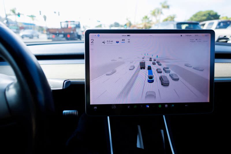 FILE PHOTO: Tesla Model 3 vehicle self driving in California
