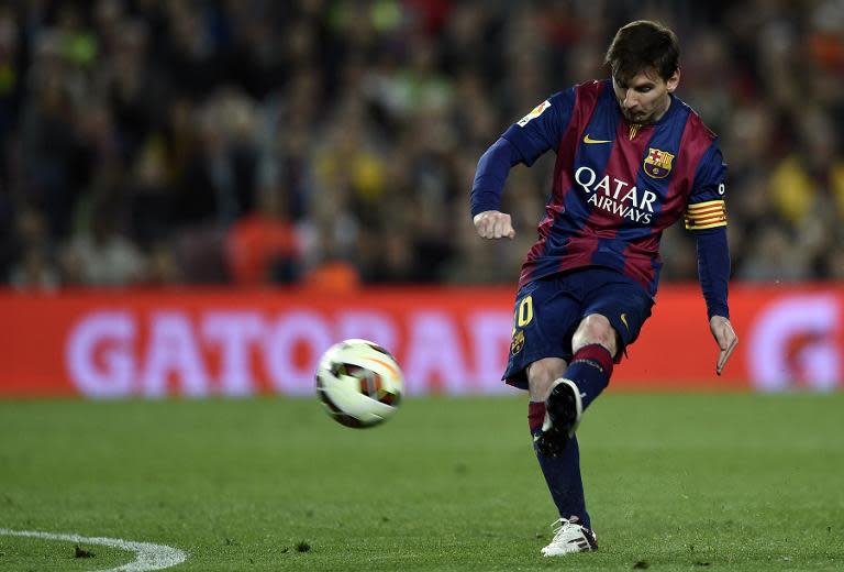 Barcelona's Argentinian forward Lionel Messi kicks a ball during the Spanish league football match FC Barcelona vs Getafe at the Camp Nou stadium in Barcelona on April 28, 2015