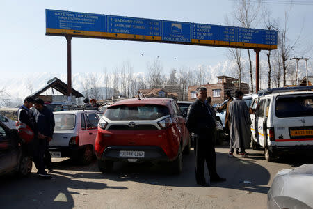 Traffic is stopped as the Indian Central Reserve Police Force (CRPF) convoy moves along a national highway in Qazigund March 18, 2019. REUTERS/Danish Ismail